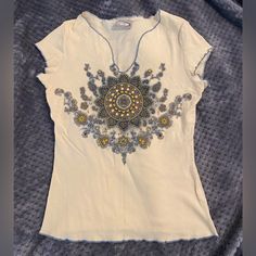 Perfect Condition! Very Cool! Beaded Festival Style Top In Off White, Blue, Brown And Gold . Such A Cool Top That I Never Even Got To Wear! It Has Blue Thread Trim Along The Edges And A Super Cute Pattern On It. Is Definitely Festival Style With A Cute Felt Hat Or Could Be Western With Boots And A Cowboy Hat. Sz M Juniors Save $3 On Shipping If You Message Me Smoke Free Home. Like It? Make An Offer Or Ask Any Questions. Thank You Vintage Beaded Tops For Summer, Bohemian Beaded Blue Top, Blue Bohemian Beaded Top, Beaded V-neck Top For Festivals, Bohemian Blue Beaded Top, Summer Beaded V-neck Tops, Summer V-neck Beaded Top, Bohemian Beaded V-neck Top, Beaded V-neck Bohemian Tops