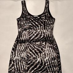 Do & Me Sleeveless Sequin Mini Dress Black And Silver Sequin Mini Dress Front Of Dress Is Sequin, Back Is All Black Sleeveless Dress With Round Neckline 32" Length From Strap To Hem Nwot Black Sleeveless Glamorous Sequin Dress, Glamorous Black Sleeveless Sequin Dress, Metallic Sleeveless Sequin Dress For Party Season, Metallic Sleeveless Mini Dress For Cocktail, Metallic Fitted Sleeveless Sequin Dress, Metallic Sleeveless Mini Dress With Sequins, Silver Sleeveless Mini Dress For Summer, Silver Sleeveless Sequin Dress For Evening, Sleeveless Silver Mini Dress For Summer