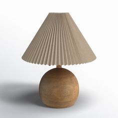 a wooden table lamp with a beige shade on it's base and a white background