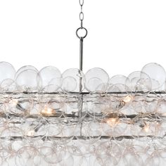 a large chandelier with clear glass balls hanging from it's center rod