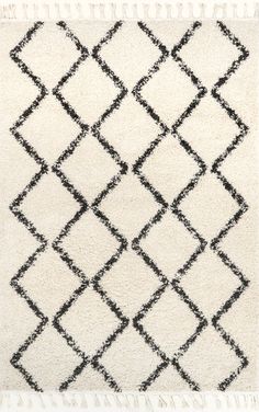 a rug with black and white designs on it