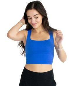 Look sleek yet feel effortless in this clean line, royal blue tank. Crafted from the softest seamless material, it's designed to offer a comfortable and flattering fit for all shapes and sizes. Get the perfect look with its subtle square neckline, sure to keep you looking and feeling your best. One size. Details: One Size 92% Nylon, 8% Spandex Blue Everyday Tank Top, Everyday Blue Tops With Built-in Bra, Everyday Blue Top With Built-in Bra, Blue Stretch Seamless Tank Top, Blue Stretch Tank Top With Seamless Construction, Stretch Blue Tank Top With Seamless Construction, Bra-friendly Solid Color Square Neck Top, Square Neck Bra Friendly Solid Top, Blue Fitted Camisole With Scoop Neck