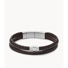 This multi-strand bracelet features braided brown leather and stainless steel magnetic closure. Classic Braided Leather Jewelry, Adjustable Leather Braided Bracelet With Stainless Steel Clasp, Brown Braided Leather Bracelets, Modern Braided Leather Bracelets, Elegant Brown Leather Bracelet With Stainless Steel Clasp, Brown Leather Braided Bracelet, Adjustable Leather Bracelets With Magnetic Closure, Braided Brown Leather Jewelry, Brown Braided Leather Jewelry