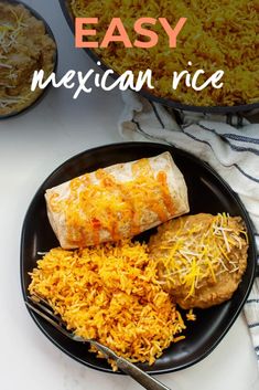 mexican rice on a black plate with two burritos and a fork next to it