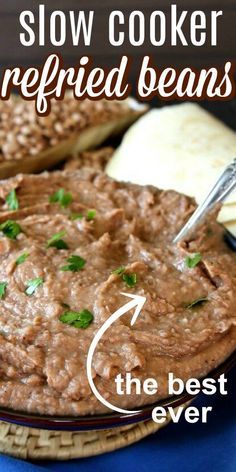 the best slow cooker refried beans recipe on a plate with bread and parsley