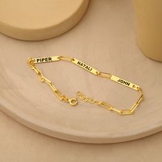 💖Personalised Engraved Name  Bracelet  - 14K Gold Plated 💖 Elevate your accessory game with our stunning ✨ Gold Plated Custom Name Bracelet. Personalized to perfection, this bracelet is a heartfelt gift for mothers, adorned with an engraved charm and delicately crafted paperclip chain. Whether it's for a birthday 🎂 celebration or Mother's Day, 🌸 this bracelet adds a touch of elegance to any outfit. The perfect blend of style and sentimentality, it features customizable options for kids' name Engraved Gold Charm Bracelet For Birthday Gift, Customized Yellow Gold Name Bracelet As Gift, Gold Charm Bracelet With Hallmark As A Gift, Customized Gold Charm Bracelet For Birthday, Customized Nameplate Bracelet For Birthday, Customizable Gold Bracelets For Gift, Customizable Gold Charm Bracelet As Gift, Personalized Gold Name Bracelet For Gifts, Yellow Gold Rectangular Name Bracelet As Gift