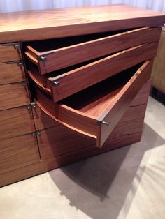 a large wooden cabinet with drawers on it