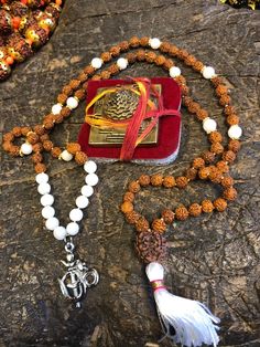 Buddhist Prayer Rudraksha White Moon STONE , Healing Meditation Mala, Bring Fortune With Brass Meru Sri YANTRA, Goddess Altar, #rudrakshamala #rudraksha #rudrakshabeads #rudrakshaseeds #rudrakshabracelet #rudraksh Tripura Sundari, Goddess Altar, Diy Tassel Necklace, Mala Beads Diy, How To Make Tassels, Sri Yantra