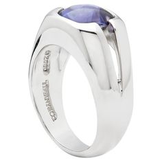 Iconic Tiffany & Co Rare Iolite ring Circa 2010 onwards Tiffany & Co fancy Cabochon Iolite set ring, mounted in 18ct White gold and perfectly set lilac Iolite. This ring comes in very good condition with little wear. Stamped Tiffany & Co 2000,  Stamped 750 Size L and a Half: US 6: European: 51 Iolite Ring, Tiffany Co Rings, Set Ring, Tiffany And Co, Cocktail Rings, Tiffany & Co., Ring Sets, Lilac, Jewelry Rings