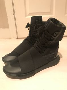 Y-3 Yohji Yamamoto Qasa Boots Triple Black BB4802 Size 9.5 US Excellent condition 8/10+ Little wear with still a ton of tread left. Please see pics. Really classy Y-3 Qasa Boots in the black colorway.  "This season, Y-3 aspires to new heights with a collection that explores verticality and elongated shapes. The Qasa Boot extends the form of the style, with an elastic band over the forefoot, an inner zip and moulded rubber details. Upper: Vamp in neoprene. Tongue and collar in textile. Elastic straps. Leather heel cap and heel collar. TPU toe cap. Lining: Suede heel lining. Cushioned Poron® performance sockliner. EVA outsole and leather heel counter." 📦 Ships within 1 business day of payment via USPS. 📦 Message me for international shipping inquiries. 🌞 Please check out my other items. H Adidas Y3, Y 3 Yohji Yamamoto, Heel Caps, Triple Black, Yohji Yamamoto, Suede Heels, Leather Heels, Elastic Band, The Black