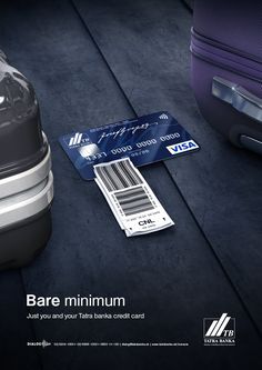 an advertisement for the american airlines has luggage and a credit card on the ground next to it