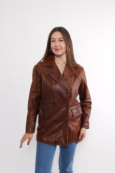 Hi! This is vintage from 80s brown leather jacket with double breasted front closure. This retro trench coat made of LEATHER with polyester lining. The model in the photo is 170 cm tall and is wearing a MEDIUM size coat. But, be careful, this is a vintage size, it is better to check the measurements below in the product description. Sleeve - 39cm / 15.35inch; ( armpit to end of sleeve); Width - 45cm / 17.71inch; Length - 73cm / 28.74inch. All measurements are taken seam to seam while lying flat. Winter Leather Jacket With Double-breasted Button, Vintage Long Leather Jacket For Fall, Fall Leather Jacket With Double-breasted Button, Double-breasted Leather Jacket, Brown Double-breasted Leather Jacket For Work, Double-breasted Brown Leather Jacket For Work, Vintage Double-breasted Leather Jacket For Fall, Vintage Brown Long Pea Coat, Vintage Long Brown Pea Coat