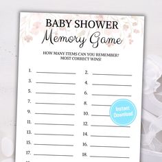 a baby shower memory game is shown on a white background with pink flowers and blue ribbon