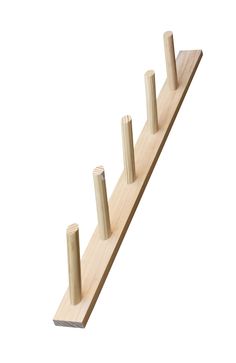 three wooden pegs on top of each other