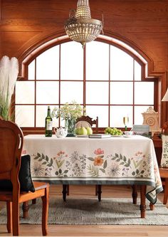 a dining room table covered with a white tablecloth