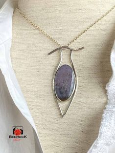 Purple jasper surrounded by a delicate framework of .999 Fine Silver. Elegant Jasper Gemstone Jewelry, Artisan Silver Jasper Jewelry, Elegant Silver Jasper Jewelry, Jasper Cabochon Jewelry For Gifts, Jasper Cabochon Jewelry Gift, Artisan Jasper Jewelry In Oval Shape, Cabochon Jasper Jewelry As Gift, Elegant Agate Oval Pendant Jewelry, Elegant Agate Jewelry With Large Stone