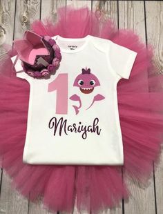 Baby shark birthday, baby shark shirt, baby shark pink, first birthday outfit, baby shark themed par Baby Shark Shirt, Pink First Birthday, Shark Themed Party, Baby Shark Birthday, Shark Girl, Minnie Mouse 1st Birthday, Minnie Mouse Outfits, First Birthday Outfit, Shark Shirt