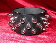 3-Row Spiked Wristband Gothic Studded Leather Bracelet For Concerts, Gothic Wristband With Rivets For Concerts, Punk Festival Wristband With Rivets, Gothic Leather Bracelet With Spikes For Party, Rock Style Rivets Wristband For Festivals, Rock Style Wristband With Rivets For Concerts, Rock Style Wristband With Rivets For Festivals, Punk Leather Bracelet With Spikes For Festival, Spiked Wristband