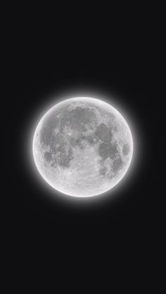 an airplane flying in front of the moon