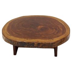 a round wooden table with two legs and a wood slab in the center on an isolated white background