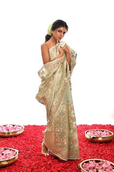 Designed to stand out from the crowd, this one-of-a-kind creation in Sage Green is a luxurious choice crafted with fine Gota Patti hand work on exquisite Organza silk. An exclusive piece, it radiates timeless elegance and looks stunning in any setting. Elegant Pre-draped Saree With Chikankari For Festive Occasions, Elegant Festival Pre-draped Saree With Resham Embroidery, Formal Festive Pre-draped Saree With Intricate Embroidery, Formal Bollywood Organza Pre-draped Saree, Elegant Silk Pre-draped Saree For Festive Occasions, Silk Pre-draped Saree With Zari Work For Formal Occasions, Formal Silk Pre-draped Saree With Zari Work, Elegant Silk Pre-draped Saree With Cutdana, Elegant Festive Pre-draped Saree With Intricate Embroidery