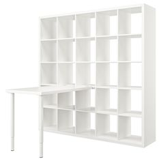 a white bookcase with shelves and a desk in front of it on a white background