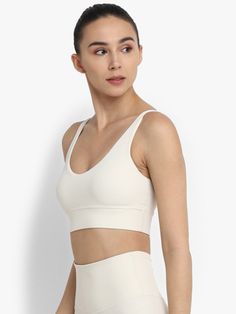 Ivory Inspire Sports Bra Beige Sports Bra With Built-in Bra, White Yoga Sports Bra With Built-in Padding, Seamless Yoga Sports Bra With Wide Straps, Beige Sporty Activewear With Built-in Bra, White Compressive Bra With Light Support, White Compressive Bra, Compressive White Bra, White Compressive Fit Bra, White Athleisure Bra For Light Exercise