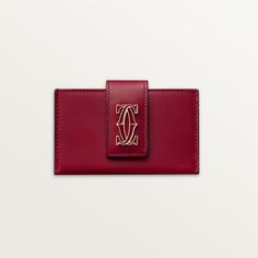 Cartier - Accordion card holder, C de Cartier - Wallet  - C de Cartier accordion card holder in cherry red calfskin. 4 credit card pockets and 1 insert between each pocket. 1 press stud. Interior: black lambskin, golden hot-stamped "Cartier" signature. Dimensions: height 65 mm x length 105 mm. Cartier Wallet, Trinity Bracelet, Trinity Necklace, Accordion Cards, Cartier Earrings, Cartier Necklace, Coin Holder, Love Ring, Love Bracelets