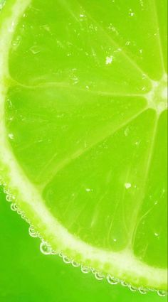 a slice of lime with water droplets on it