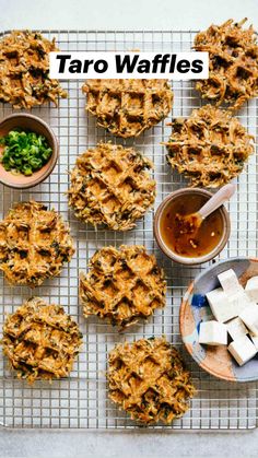 an overhead view of some food on a cooling rack with bowls of sauces and marshmallows