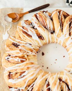 a cinnamon bundt cake with icing on a cutting board