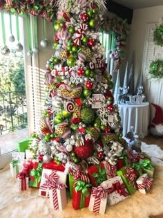 a christmas tree decorated with ornaments and bows