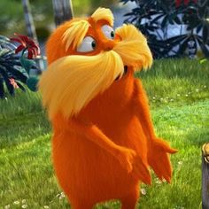 the lorax is standing on its hind legs in front of a tree stump