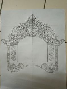 a drawing of an ornate arch on paper