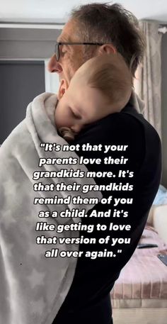 an older man holding a baby wrapped in a blanket with the caption it's not that your parents love their grandkids more