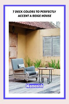 a blue chair and table sitting on top of a wooden floor next to a yellow house