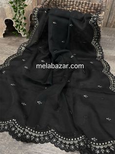 Organza dupatta with embroidery on the scalloped edge. Elegant Embroidered Shawl For Eid, Black Silk Dupatta With Chikankari Embroidery, Georgette Shawl For Eid, Festive Black Shawl With Embroidered Border, Black Embroidered Border Unstitched Dupatta, Elegant Dupatta With Embroidered Border For Eid, Black Dupatta For Festive Occasions, Semi-stitched Elegant Georgette Shawl, Black Pashmina Dupatta With Resham Embroidery