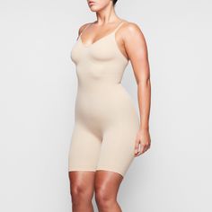 With a mid-thigh length, this essential shapewear bodysuit holds in your core, shapes and lifts your butt and chest, and smooths your upper thighs. Sculpting Bodysuit, Shapewear Bodysuit, Waist Trainer, Natural Shapes, Dresses Xs, Shapewear, I Dress, Everyday Wear, Fashion Inspo