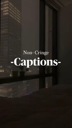 the words captions are in front of a cityscape with skyscrapers at night