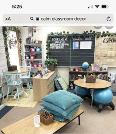 a room with tables, chairs and bookshelves on the walls is decorated with greenery