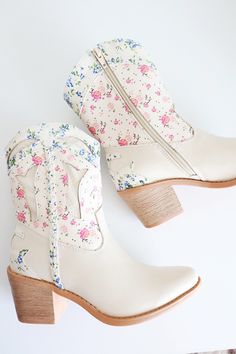 Western style floral boot Flower print and textured upper Braid detail on side Inside Zipper Tapered block heel Boots With Flowers In Them, Floral Cowboy Boots, Boots With Flowers, Cute Western Outfits, Shoe Room, Fun Shoes, Floral Boots, Cute Sneakers, Floral Shoes