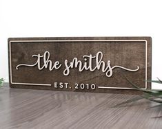 a wooden sign that says the smiths on it