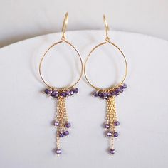 "FREE SHIPPING on our delicate, extremely lightweight amethyst hoop earrings. Entirely handmade. These make great graduation gifts, birthday gifts or gifts for mom. - Amethyst gemstones - 2.75\" long - French hooks - 14k gold plated fine Italian silver - Made in the USA in our New York City studio - Arrives in a gift box Our unique plating technique is designed to be tarnish resistant. The natural shapes of gemstones make each pair one-of-a-kind. Follow us on INSTAGRAM www.instagram/parkenjewelr Everyday Purple Jewelry With Ear Wire, Purple Round Hoop Earrings As Gift, Purple Hoop Earrings As Gift, Purple Round Hoop Earrings For Gift, Elegant Small Hoop Purple Earrings, Elegant Purple Hoop Earrings As Gift, Elegant Purple Hoop Earrings For Gifts, Elegant Purple Small Hoop Earrings, Purple Dangle Hoop Earrings As Gift