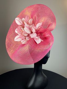 Stunning coral pink sinimay with gold threading hand-shaped into a beautiful saucer and accented with coral pink and white velvet leaves. Sits on a comfortable gold headband. Lightweight and easy to wear. Ships in a high quality storage box. One of a kind.  Perfect for Kentucky Derby, Royal Ascot, church, weddings, just for fun. Elegant Handmade Pink Hat, Handmade Pink Headpieces For Spring, Pink Formal Fascinator With Pinched Crown, Pink Pinched Crown Fascinator For Formal Occasions, Handmade Pink Wedding Headpiece, Elegant Pink Fascinator For Ceremony, Handmade Pink Fascinator For Party, Handmade Pink Fascinator For Wedding, Elegant Pink Headpieces For Ceremonies