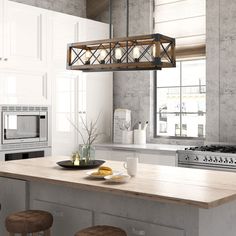 a kitchen with an island, stove and microwave