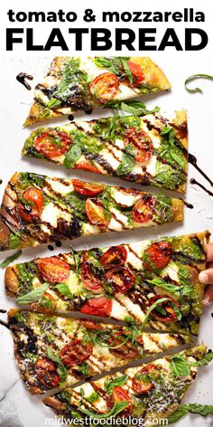 four flatbreads with tomatoes, mozzarella and spinach on the side