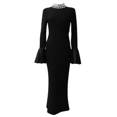 This elegant Maxi Dress features a flounce sleeve and a mock-neck, adding a touch of sophistication. The crystal decoration on the collar adds a subtle shimmer, making it perfect for any special occasion. In classic black, this bandage dress highlights your silhouette and guarantees a timeless and chic look. Fabric: Medium Stretch Material: Polyester, Elastane Elegant High Neck Evening Dress For Formal Occasions, Chic High Neck Evening Dress, Elegant Long Sleeve Embellished Midi Dress, Elegant High-neck Dresses For Night Out, Glamorous High Neck Midi Dress For Evening, Elegant Fitted High Neck Dress, Elegant High Neck Fitted Dress, Elegant High Neck Dress For Night Out, Elegant Long Sleeve Evening Dress With Ruffles