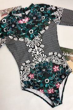 Ethnic one piece swimsuit featuring stand collar, long sleeve and zip back, brief cut leg design and floral printSize Guide:Size (in)USBustWaistHipS4-632-3424-2634-36M8-1034-3626-2836-38L12-1436-3828-3038-40XL1638-4030-3240-42 Cowboys Cheerleader Costume, Dallas Cowboys Cheerleader Costume, Cheerleader Costume, Men In Heels, Rashguard Swimsuit, Swimsuit Sale, Floral One Piece, Halloween Costume Outfits, Green Swimsuit