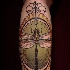 an image of a dragonfly tattoo on someone's leg with the caption repost @ nichisgreen