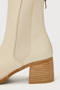 All your favorite fall 'fits are definitely going to include the Karlach Light Nude Low Heel Ankle Booties! Faux pebbled leather shapes these essential autumn boots that feature an almond-shaped toe upper and a 6.25"" ankle-high shaft with a 5.5"" zipper at the back and elastic gussets on either side. A stacked block heel completes the trendy look! 2. 5" stacked wood-look block heel. Lightly cushioned insole. Nonskid rubber sole. Man made materials. Imported. Lulus | Karlach Light Nude Low Heel Beige Ankle Booties With Stacked Heel, Spring Chelsea Boots With Stacked Heel And Round Toe, Trendy Beige Boots With Reinforced Heel, Spring Chelsea Boots With Stacked Heel, Beige Faux Leather Boots With Reinforced Heel, Beige Boots With Sculpted Heel For Fall, Beige Ankle Boot With Sculpted Heel, Cream Boots With Sculpted Heel And Medium Width, Cream Boots With Sculpted Heel And Round Toe